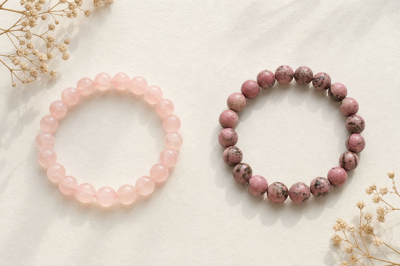 Rose quartz and rhodonite natural gemstone bracelets arranged for comparison